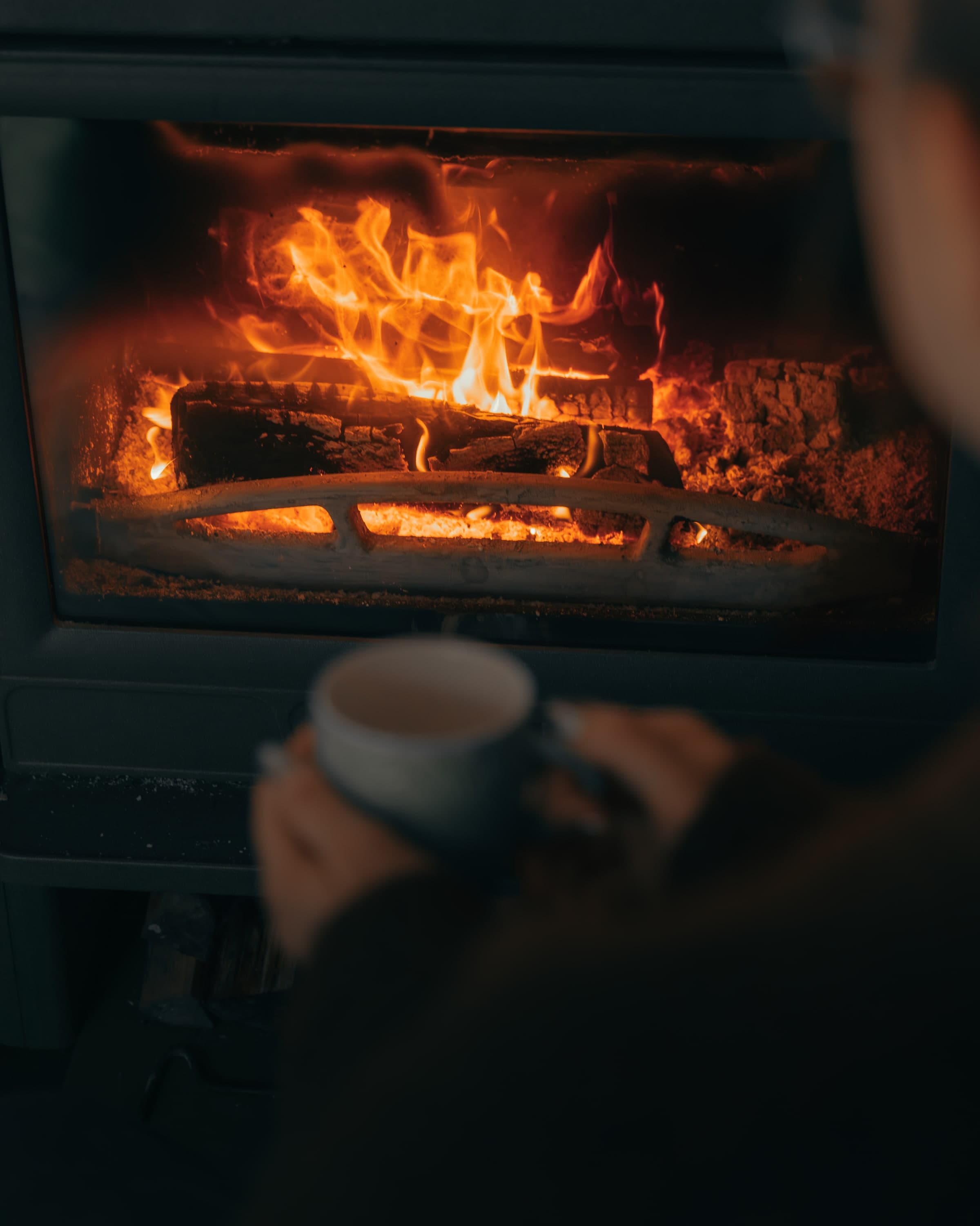 Coffee in hand, fire in the wood stove