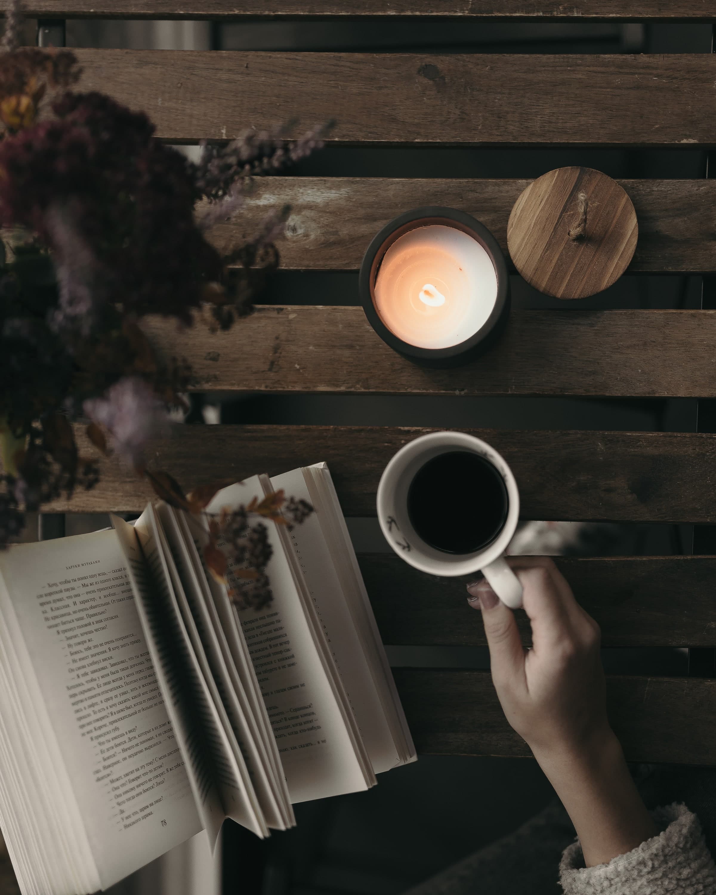 Candle, dried flowers, book, coffee