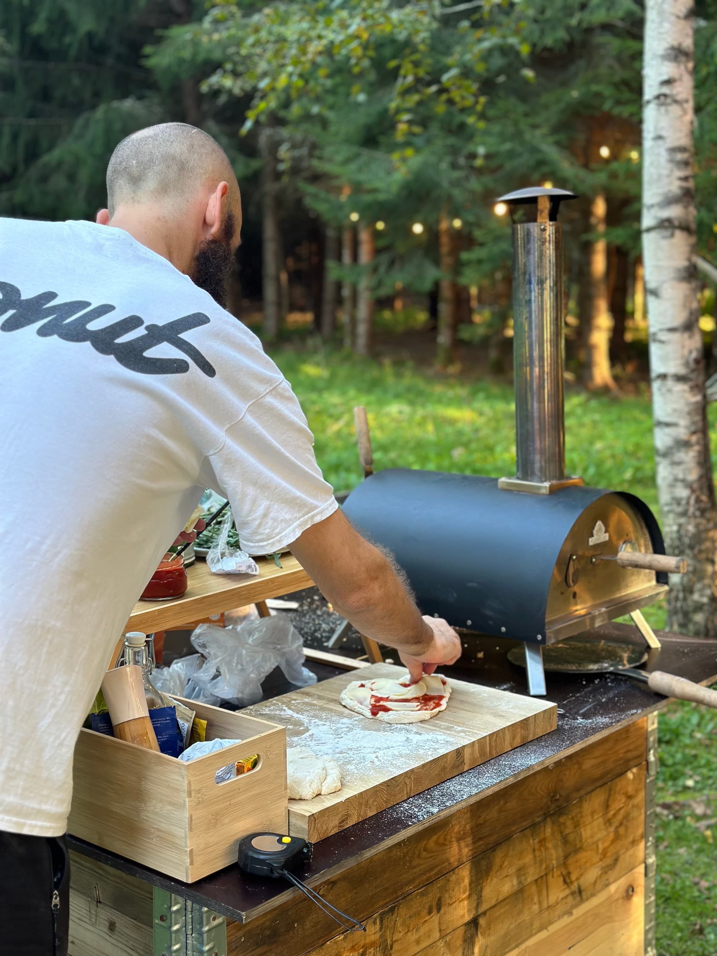 Pizza being prepared at the outdoor pizza oven