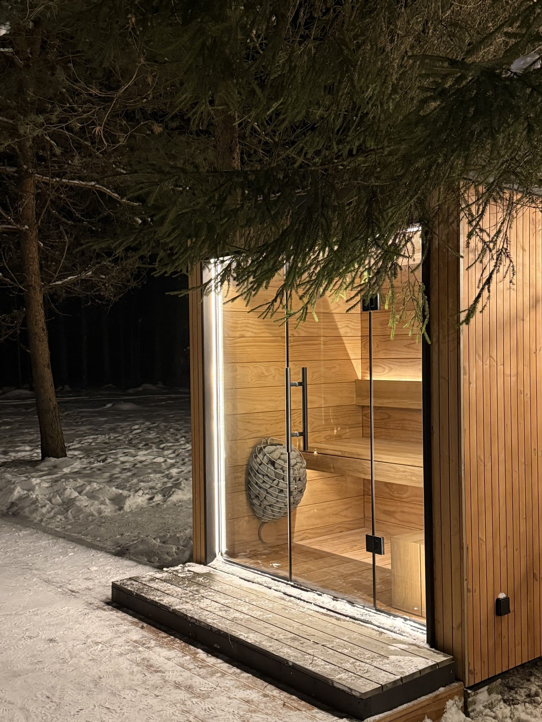The sauna door, cedar interior, spruce above